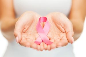 hands holding pink breast cancer awareness ribbon