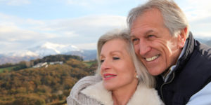Portrait of happy senior couple in countryside