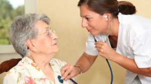 Elderly person with nurse